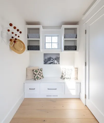 a view of a refrigerator a sink and a microwave