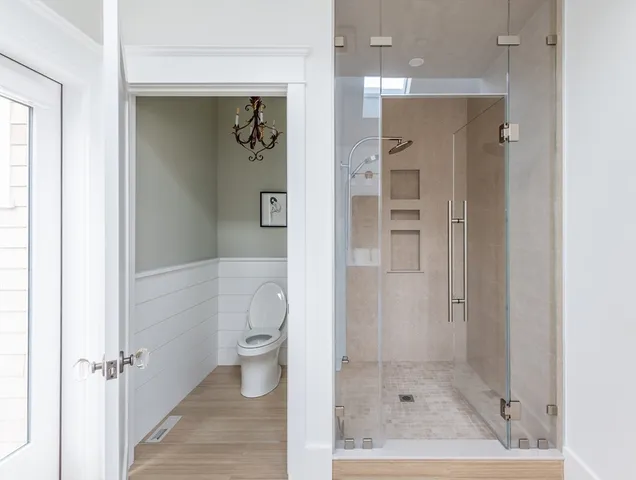 a bathroom with a shower and a toilet