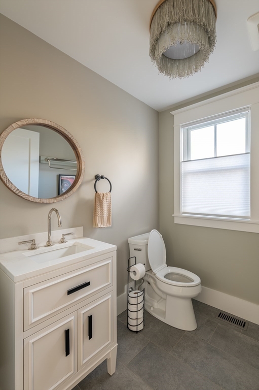 75 Streeter Hill Road Falmouth, MA 02556 - Photo 21 of 32 a bathroom with a toilet a sink and mirror