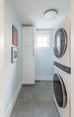 a view of a bedroom with washer and dryer
