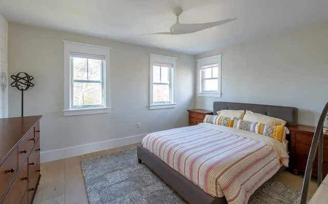 a view of a balcony with furniture and wooden floor