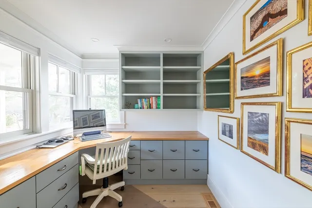 a kitchen with stainless steel appliances kitchen island granite countertop a stove a sink and a cabinets