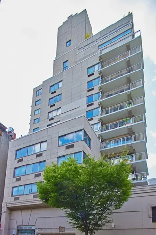 a living room with furniture fireplace and large window