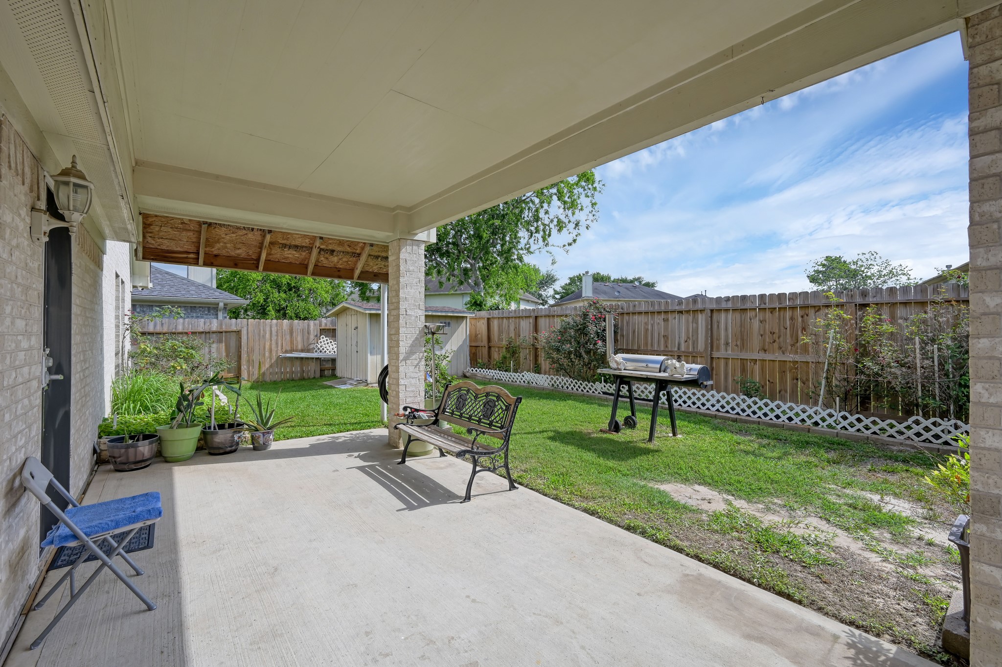 2539 Forge Creek Road Houston, TX 77067 - Photo 38 of 40 The back patio is the perfect place to relax. The backyard features a newer fence and a storage shed.