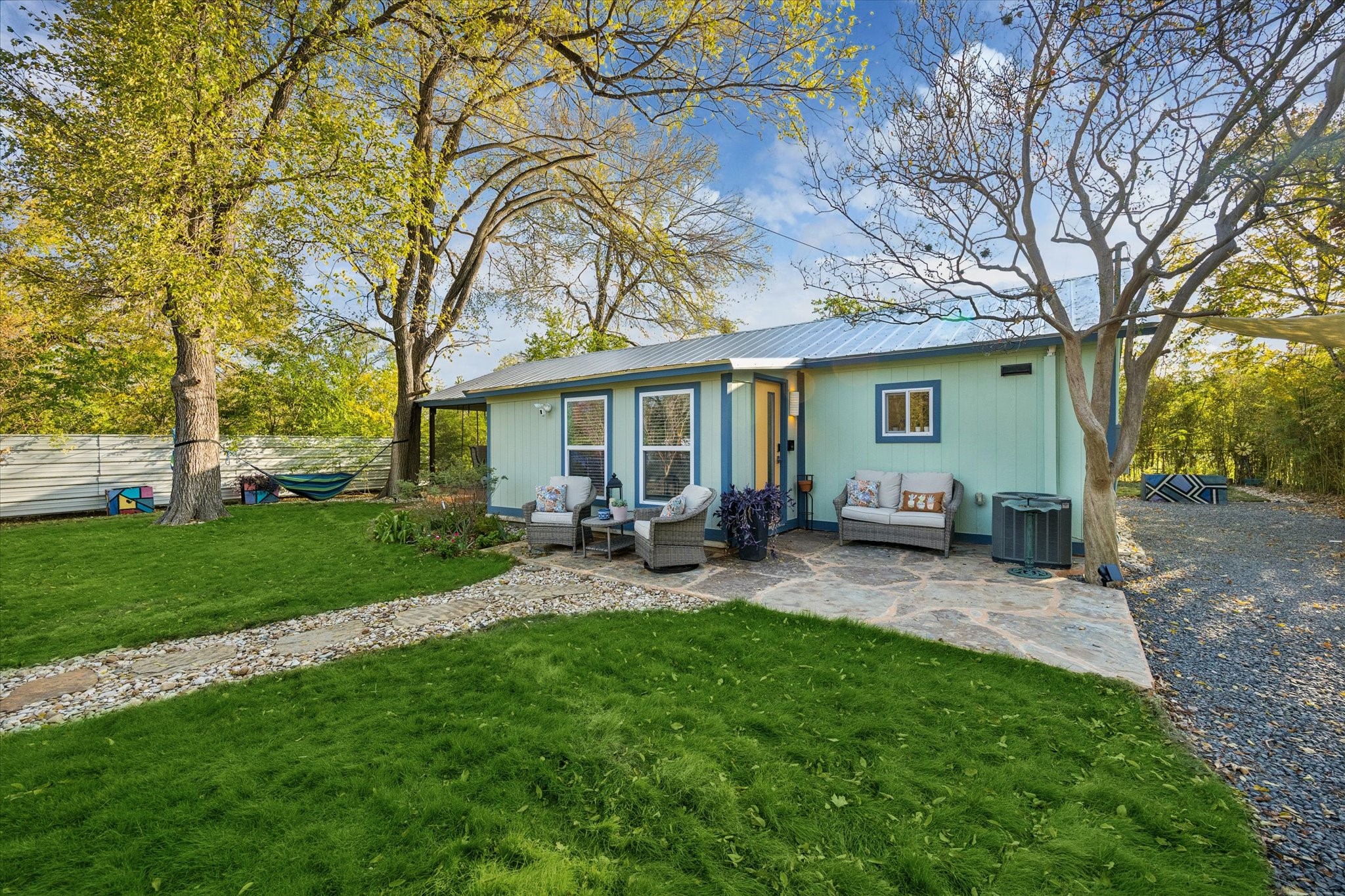 4901 Prock Lane Austin, TX 78721 - Photo 26 of 41 a view of a house with backyard sitting area and garden