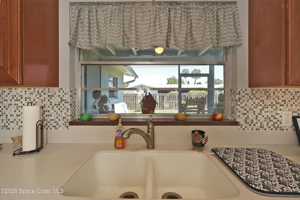 a bathroom with a bathtub and next to a window