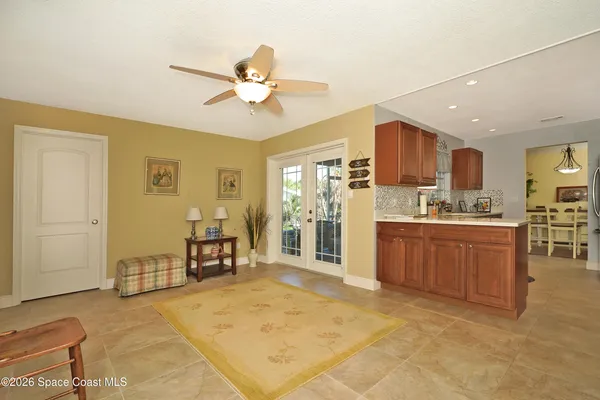 a open kitchen with stainless steel appliances granite countertop a refrigerator stove top oven and sink