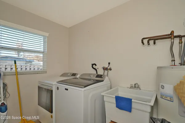a bathroom with a sink a toilet and tub