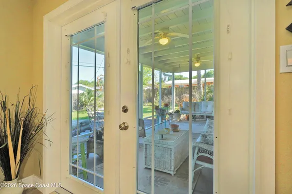 a bathroom with a glass shower door and a window
