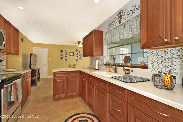 a kitchen with a sink counter top space and cabinets