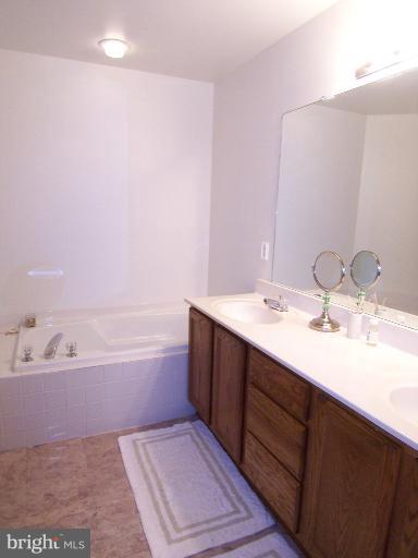 4511 Ingham Road Owings Mills, MD 21117 - Photo 7 of 13 Upstairs Bath w/ Double Sinks & Soaking Tub