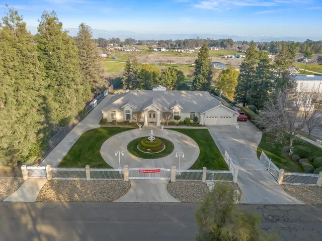 an aerial view of a house with outdoor space