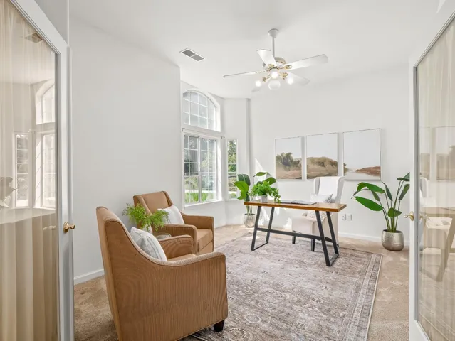 a dining hall with dining table and chairs
