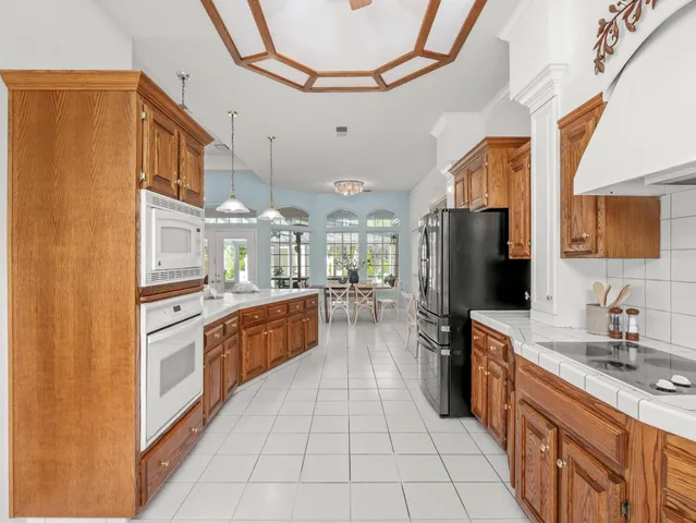 a bedroom with a large bed and a flat screen tv