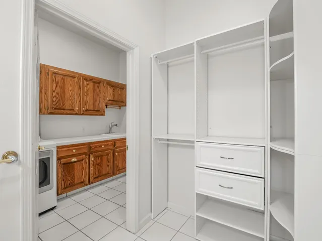 a view of a lake with boats and large trees