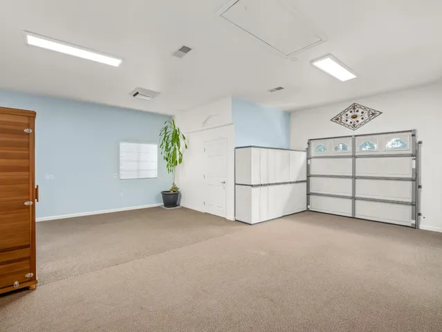 an aerial view of residential house with outdoor space and swimming pool