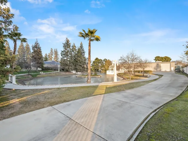 a view of a fountain in front of a house