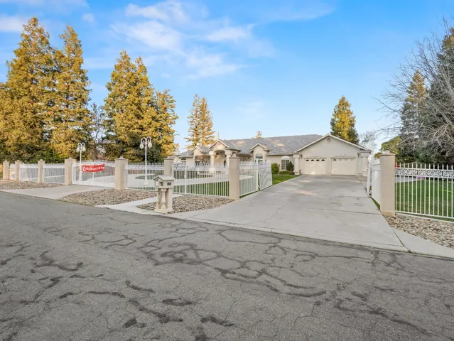 an aerial view of a house with a swimming pool