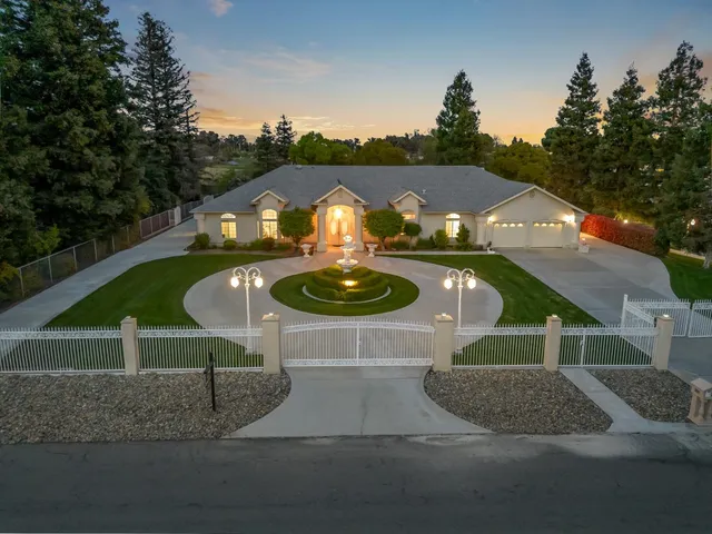a living room with fireplace furniture and a flat screen tv