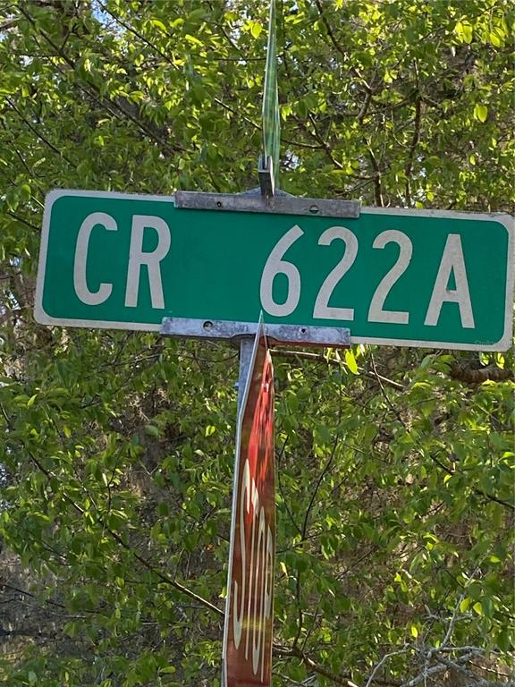 Undisclosed Address Bushnell, FL 33513 - Photo 3 of 4 a street sign that is on a pole
