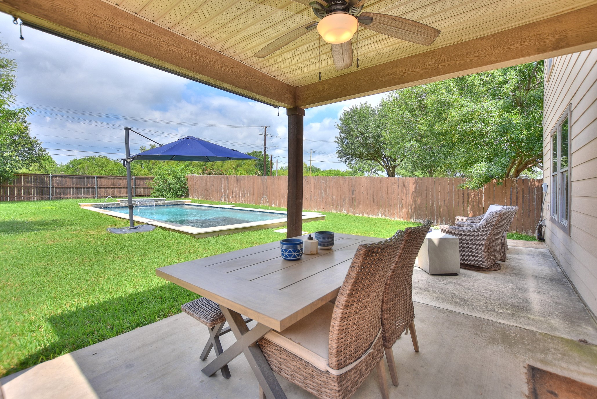 74 Jan Lane Georgetown, TX 78626 - Photo 5 of 31 a view of a patio with a table chairs and backyard