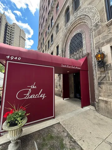 a view of a building with potted plants