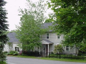 5 Train Hill Road Stockbridge, MA 01266 - Photo 1 of 1 a front view of a house with a yard and trees
