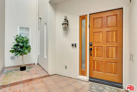 a large living room with a large tub and sink