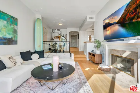 a spacious bathroom with a tub sink and mirror