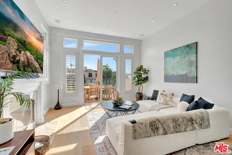 a bathroom with a tub a sink and a large mirror