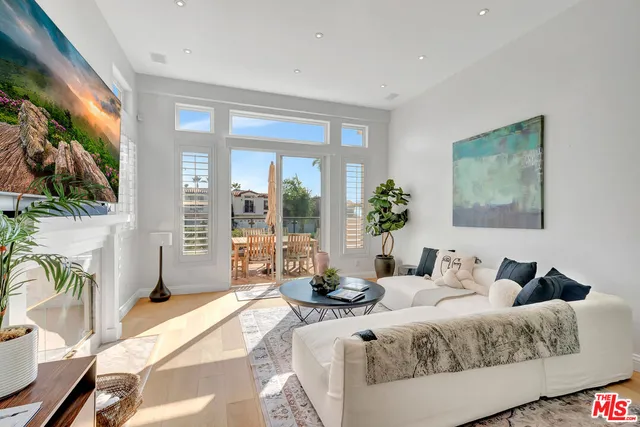 a large living room with a large tub and sink