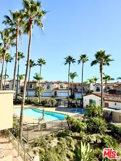 a bedroom with a bed and large window