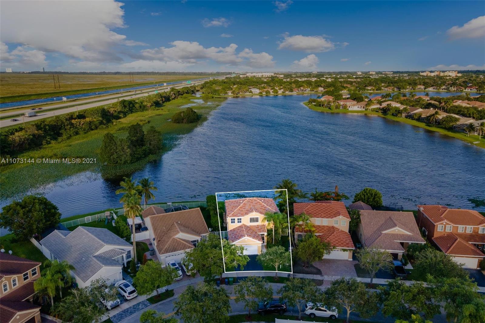 955 Falling Water Road Weston, FL 33326 - Photo 7 of 38 Aerial shot of the property and the neighborhood