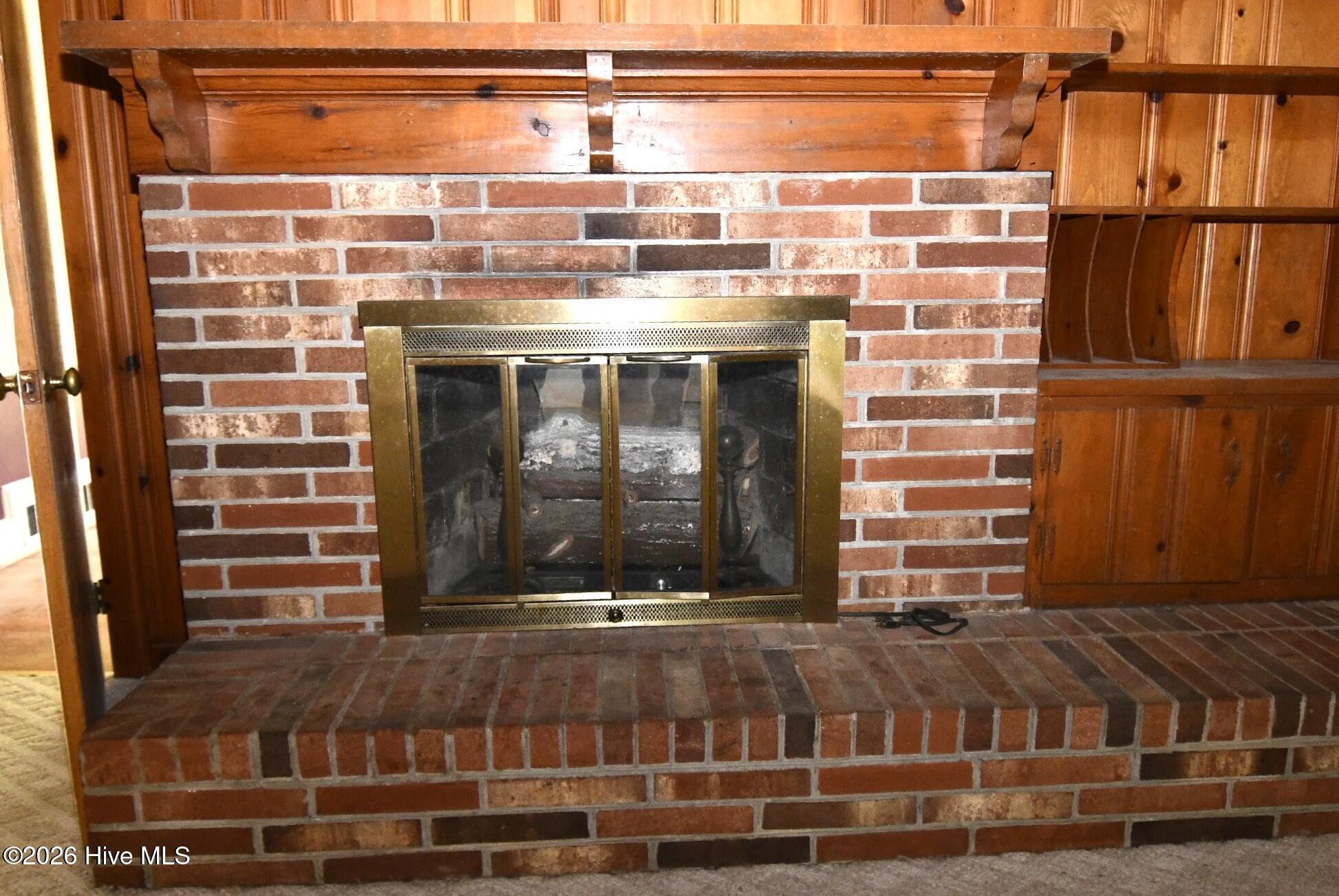 111 Fairlane Road Greenville, NC 27834 - Photo 12 of 27 Family room fire pace