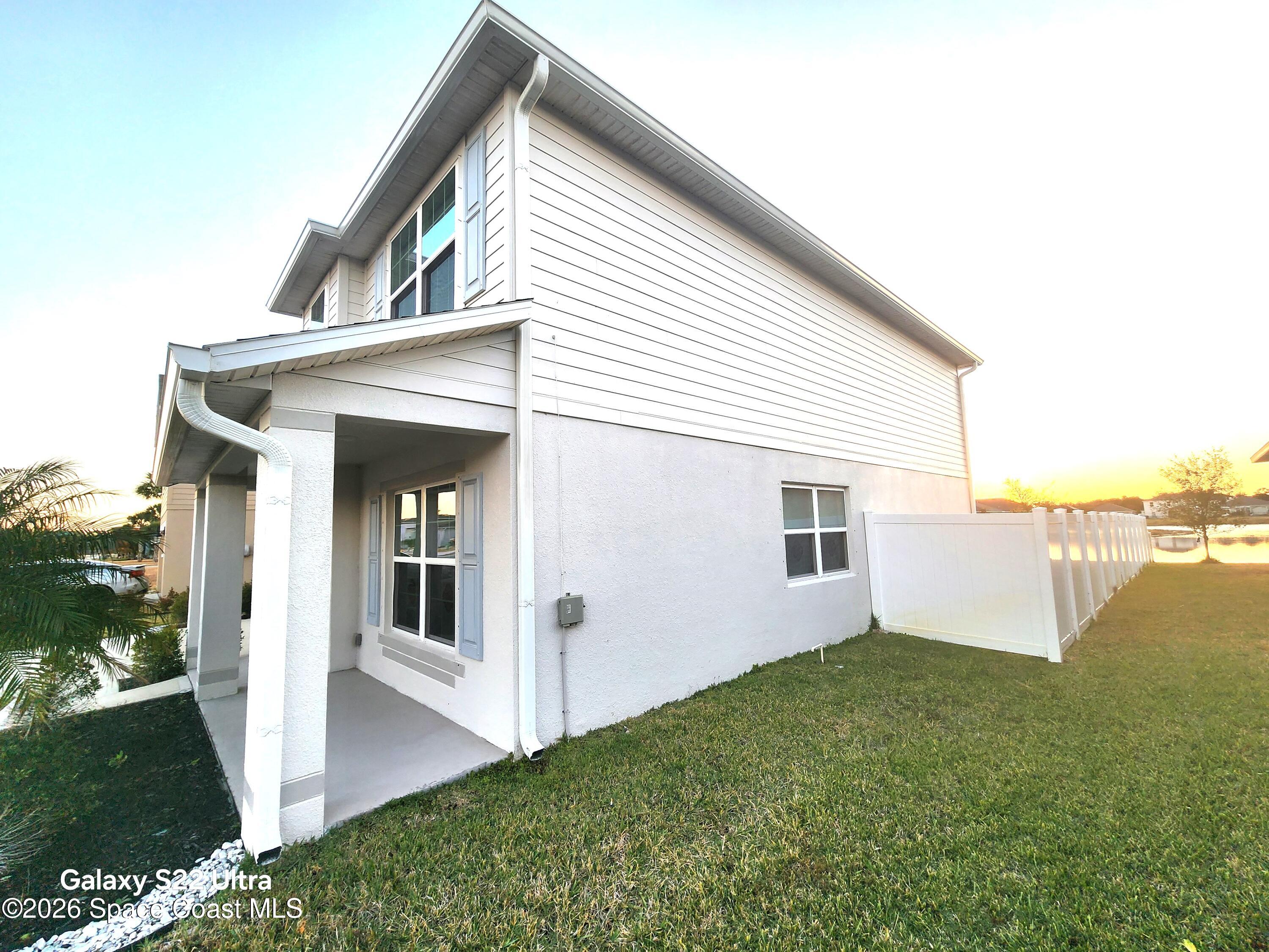 1043 Corbin Circle Southwest Palm Bay, FL 32908 - Photo 2 of 18 a view of a house with backyard