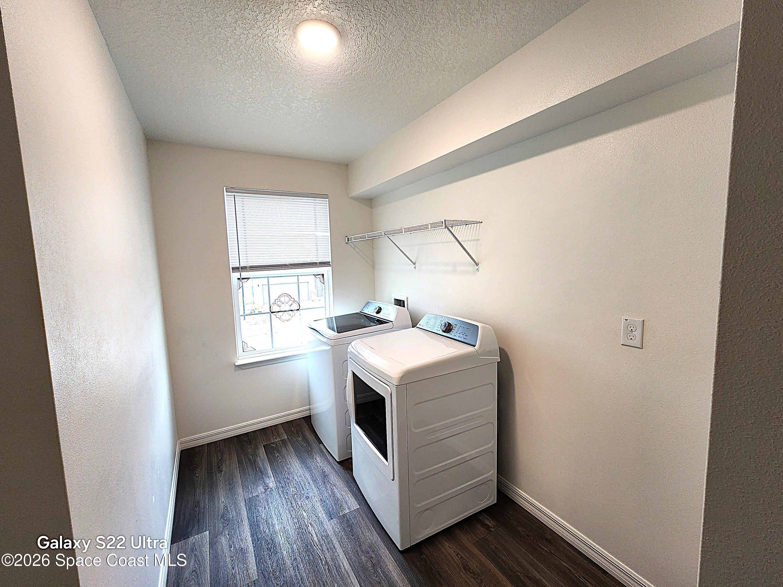 1043 Corbin Circle Southwest Palm Bay, FL 32908 - Photo 10 of 18 a utility room with washer and dryer