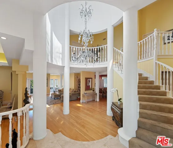 a view of entryway with a chandelier