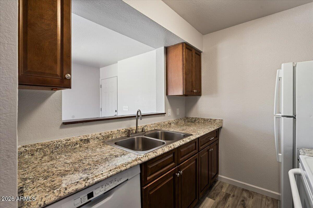 1346 East Mountain View Road, Unit 207 Phoenix, AZ 85020 - Photo 19 of 31 a kitchen with a sink and cabinets