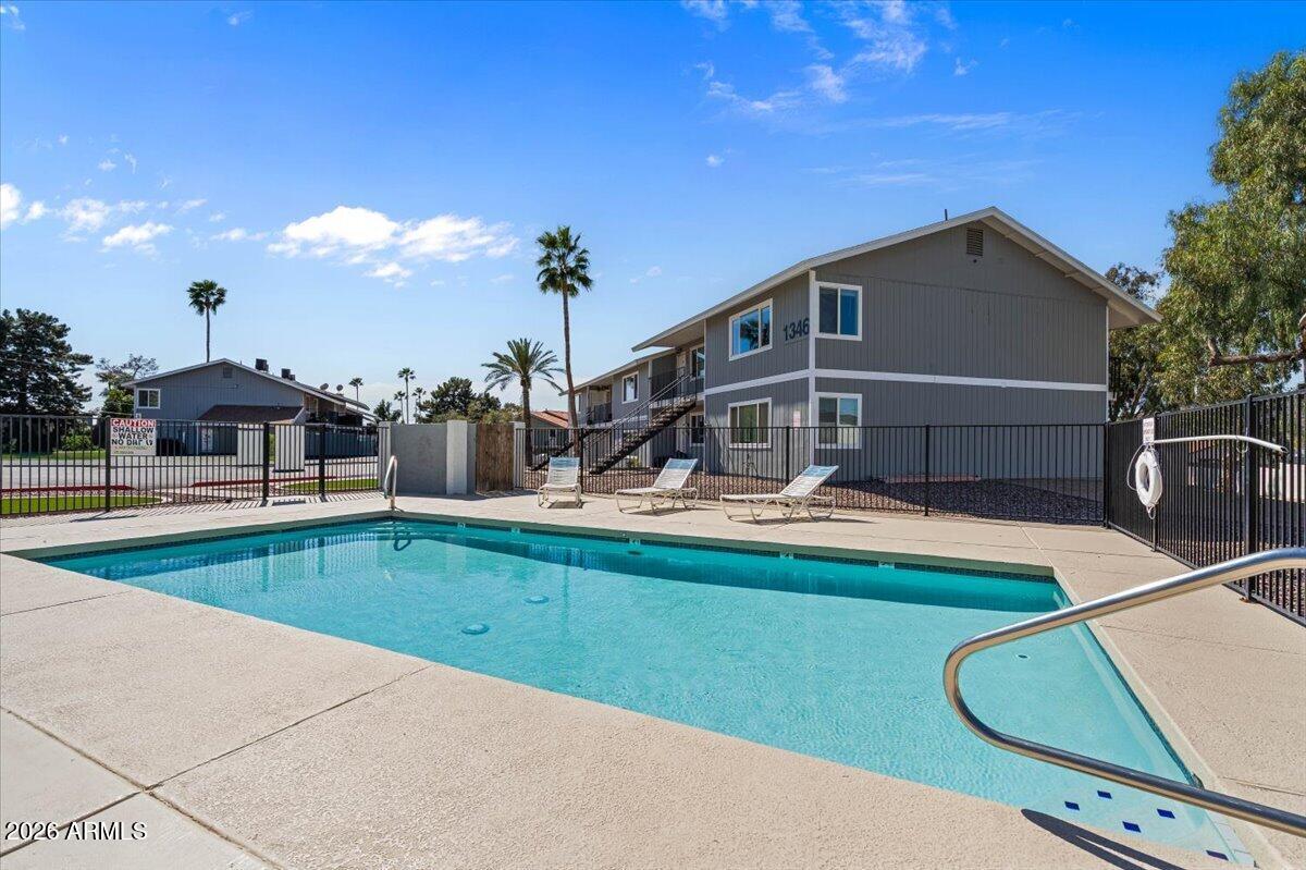 1346 East Mountain View Road, Unit 207 Phoenix, AZ 85020 - Photo 29 of 31 a view of a house with swimming pool