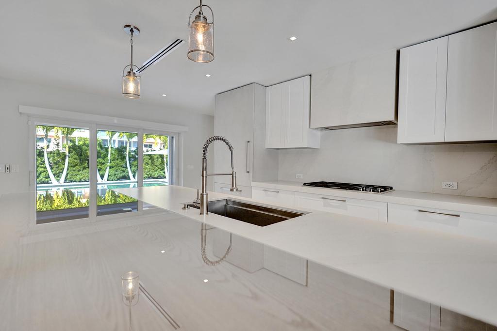 775 Northeast 39th Street Boca Raton, FL 33431 - Photo 25 of 88 a kitchen with a sink and appliances