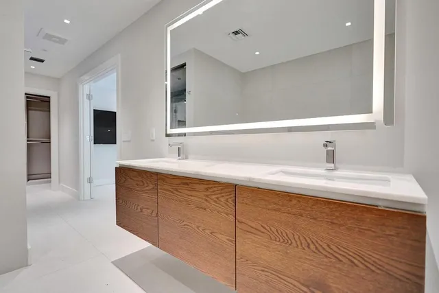 a bathroom with a sink and a mirror