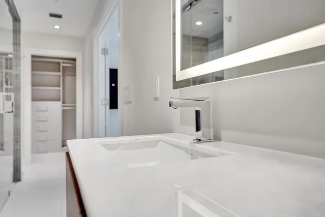 a utility room with sink dryer and washer