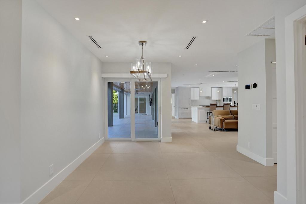 775 Northeast 39th Street Boca Raton, FL 33431 - Photo 47 of 88 a view of a kitchen with a sink and a refrigerator