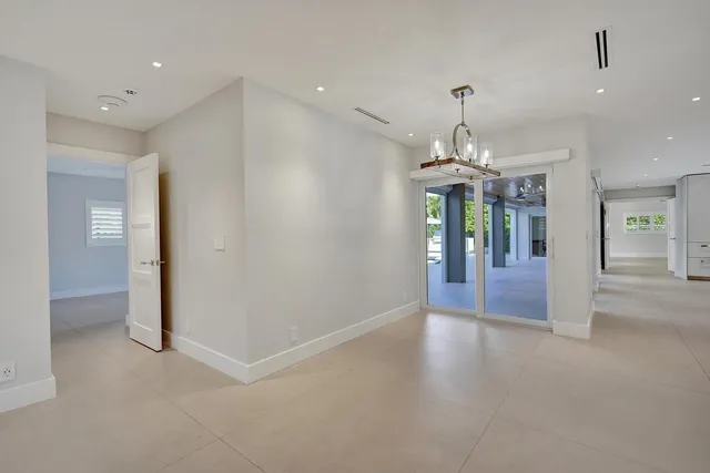 an aerial view of a house a yard and outdoor seating