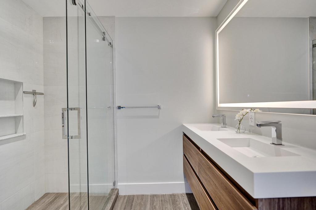 775 Northeast 39th Street Boca Raton, FL 33431 - Photo 57 of 88 a bathroom with a sink and a mirror