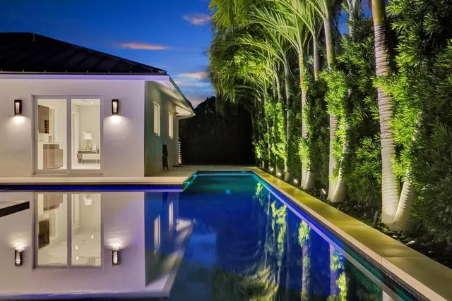a view of a hallway with toilet and a window