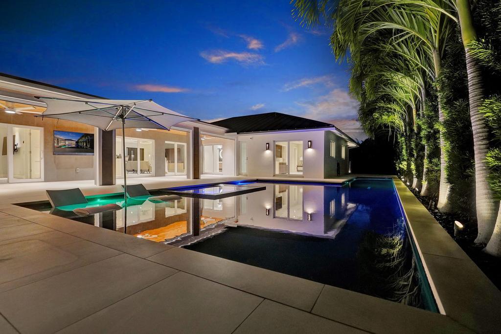 775 Northeast 39th Street Boca Raton, FL 33431 - Photo 10 of 88 a view of a house with backyard and sitting area