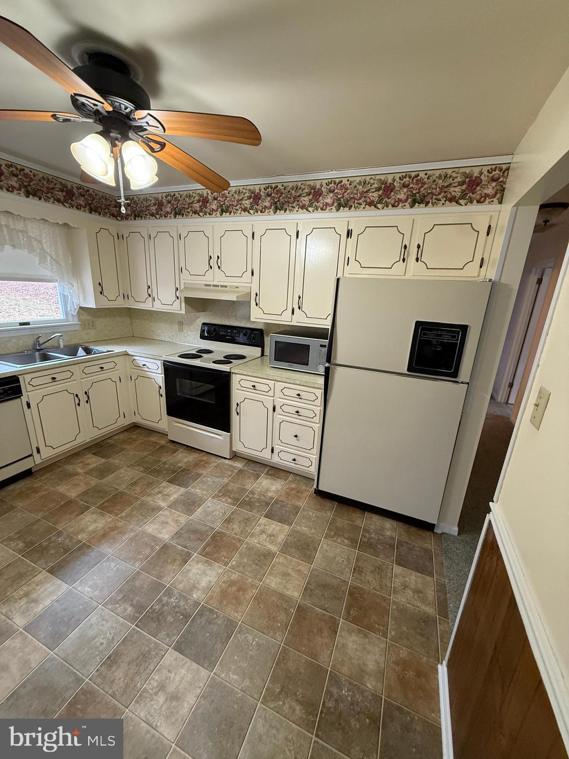 10984 Old Forge Road Waynesboro, PA 17268 - Photo 12 of 57 a kitchen with granite countertop a sink a stove top oven and cabinetry