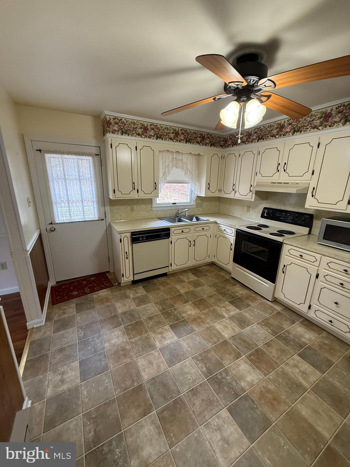 10984 Old Forge Road Waynesboro, PA 17268 - Photo 13 of 57 a kitchen with stainless steel appliances granite countertop a stove sink and cabinets