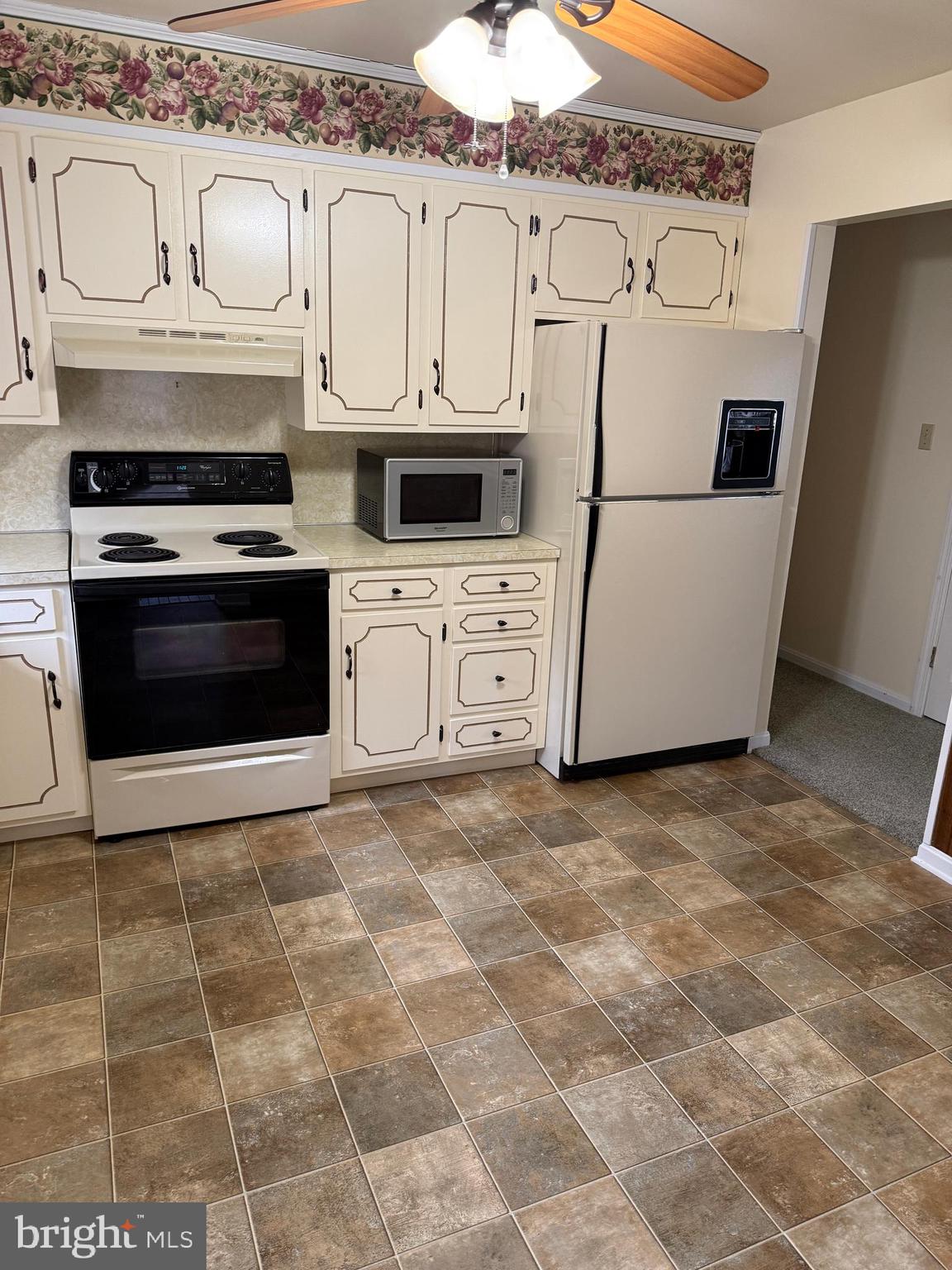 10984 Old Forge Road Waynesboro, PA 17268 - Photo 15 of 57 a kitchen with stainless steel appliances granite countertop a stove a sink and a refrigerator